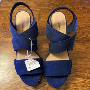 Blue faux suede criss cross wedges